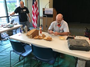 Repairing wooden toys at the Repair Café woodworking station