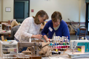 Repairing a jacket at the Repair Café sewing station