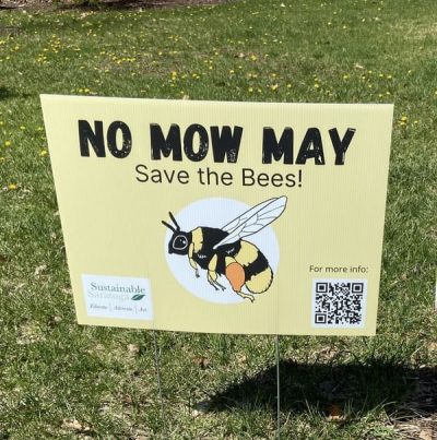 No Mow May sign in lawn