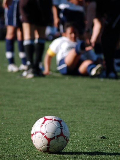 Athlete with injury on artificial turf